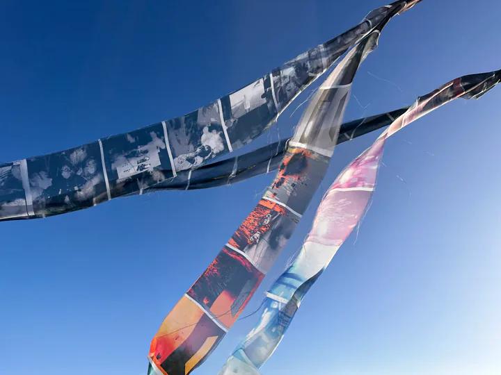 Printed Hypnos textile installation against the sky